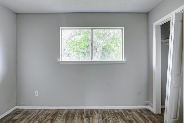 4969 E Rdg Creek Dr, Houston, TX 77053 - unfurnished bedroom featuring dark wood-style flooring and baseboards