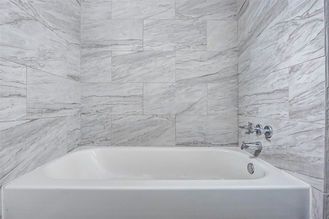 full bath featuring a tub