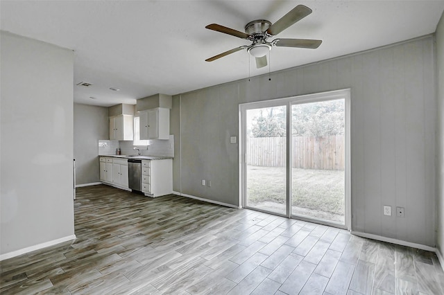 4969 E Rdg Creek Dr, Houston, TX 77053 - kitchen with dishwasher, baseboards, wood finished floors, and a sink