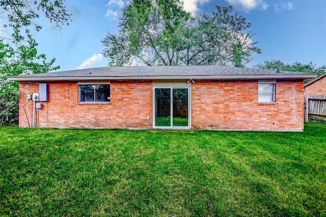 rear view of property featuring brick siding