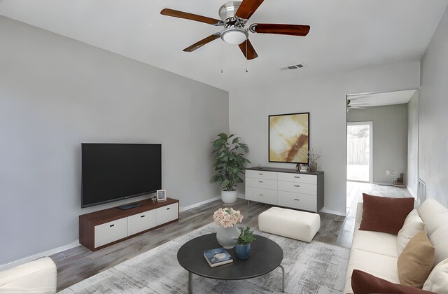 4969 E Rdg Creek Dr, Houston, TX 77053 - living area featuring ceiling fan, wood finished floors, and baseboards
