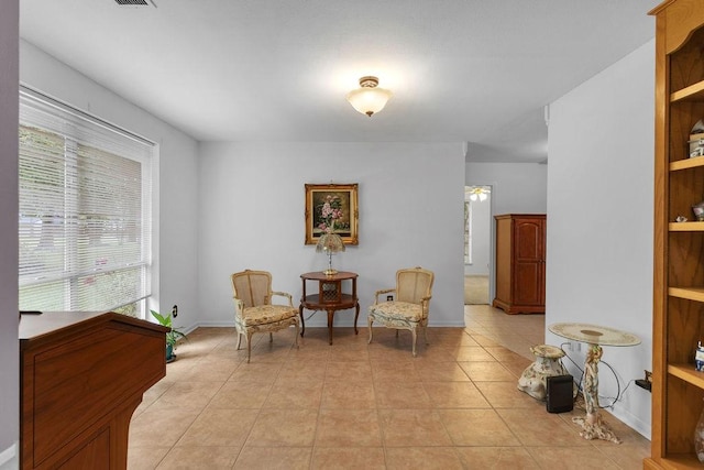 24930 Plantation Estates Ave, Porter, TX 77365 - sitting room with plenty of natural light, light tile patterned flooring, and baseboards