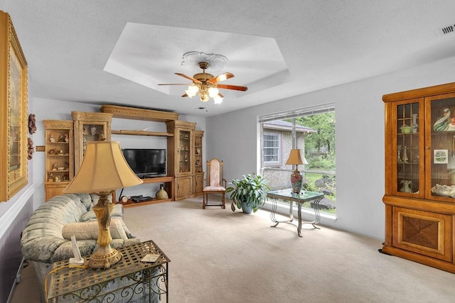 24930 Plantation Estates Ave, Porter, TX 77365 - sitting room featuring carpet flooring, a tray ceiling, and ceiling fan