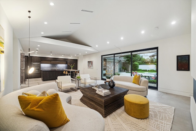 5686 Bayou Glen Rd, Houston, TX 77056 - living area with lofted ceiling, recessed lighting, baseboards, and concrete flooring