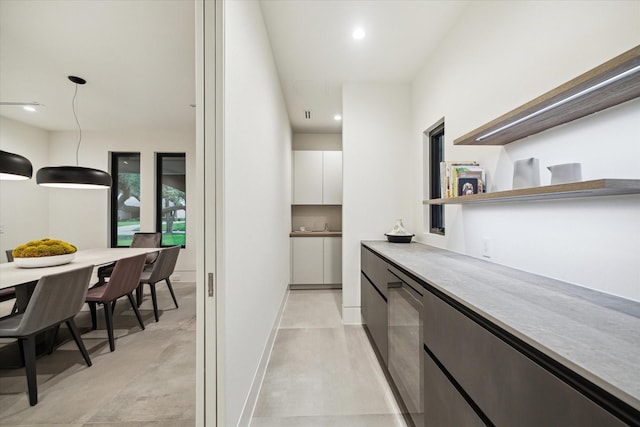 5686 Bayou Glen Rd, Houston, TX 77056 - bar area featuring decorative light fixtures, recessed lighting, and concrete flooring