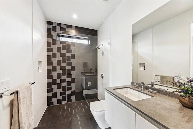 5686 Bayou Glen Rd, Houston, TX 77056 - bathroom with toilet, tiled shower, tile patterned floors, and vanity