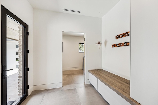 5686 Bayou Glen Rd, Houston, TX 77056 - mudroom with baseboards and concrete floors