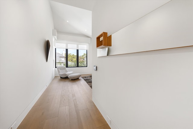 5686 Bayou Glen Rd, Houston, TX 77056 - hallway featuring vaulted ceiling, light wood finished floors, and baseboards