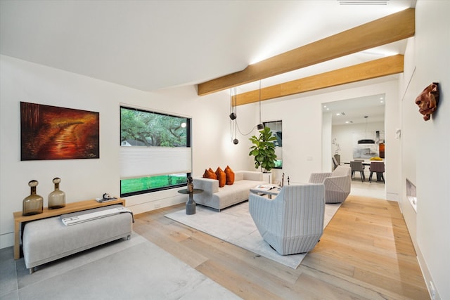 5686 Bayou Glen Rd, Houston, TX 77056 - living room featuring wood finished floors and beamed ceiling
