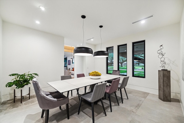 5686 Bayou Glen Rd, Houston, TX 77056 - dining room featuring recessed lighting, concrete floors, and baseboards