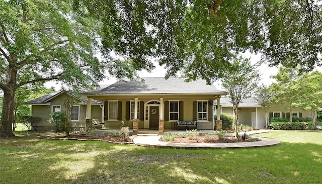 view of front facade with covered porch and a front yard