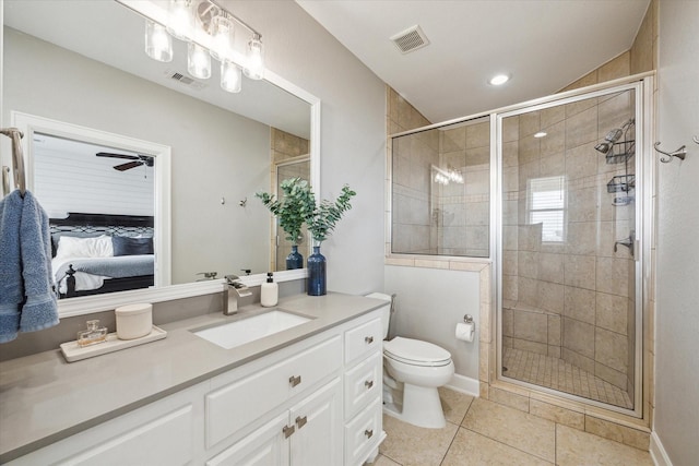 ensuite bathroom featuring toilet, a shower stall, tile patterned floors, and recessed lighting