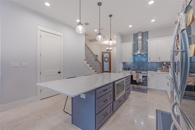 406 Fenn St Unit A, Houston, TX 77018 - kitchen featuring wall chimney exhaust hood, stainless steel appliances, backsplash, white cabinets, and recessed lighting
