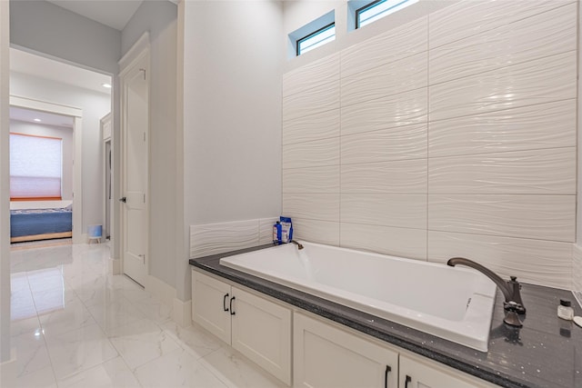 406 Fenn St Unit A, Houston, TX 77018 - bathroom with marble finish floors, a bath, and baseboards