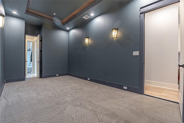 406 Fenn St Unit A, Houston, TX 77018 - carpeted empty room featuring a tray ceiling, baseboards, and crown molding