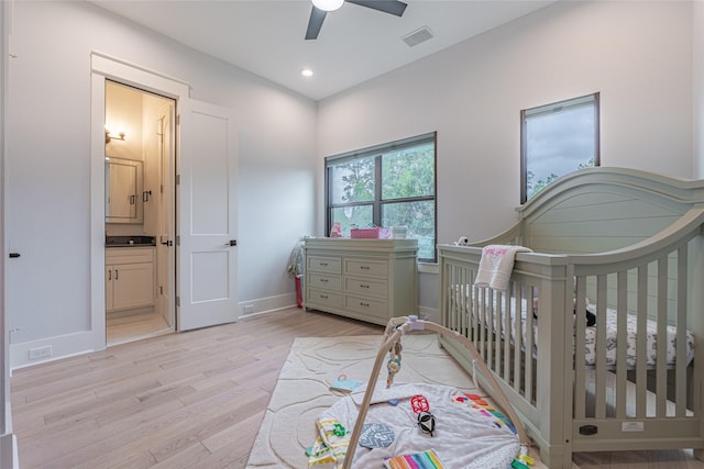 406 Fenn St Unit A, Houston, TX 77018 - bedroom with light wood-type flooring, recessed lighting, baseboards, ceiling fan, and ensuite bath