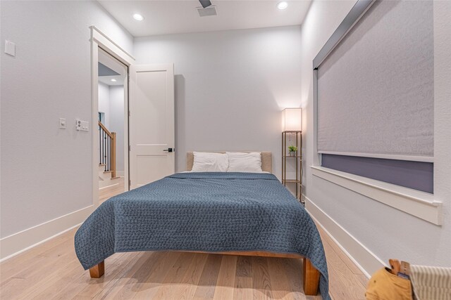 406 Fenn St Unit A, Houston, TX 77018 - bedroom with wood finished floors, recessed lighting, and baseboards