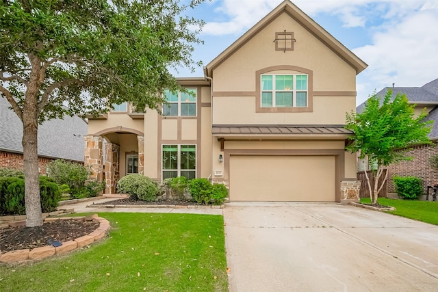 1618 Quail Ridge Dr, Katy, TX 77493 - view of front of house featuring stucco siding, concrete driveway, a standing seam roof, an attached garage, and a front yard