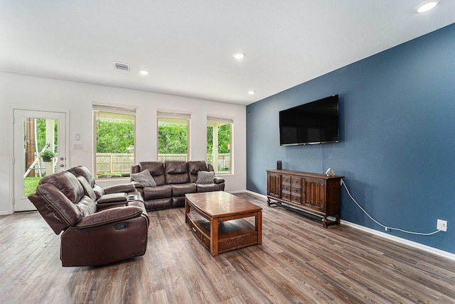 4319 Liberty Ranch Way, Baytown, TX 77521 - living room with wood finished floors, baseboards, and recessed lighting