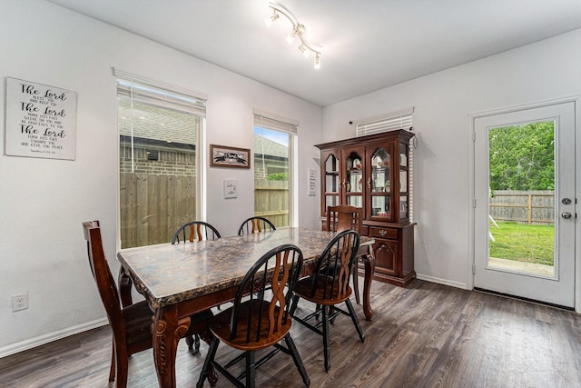 4319 Liberty Ranch Way, Baytown, TX 77521 - dining space featuring dark wood finished floors and baseboards
