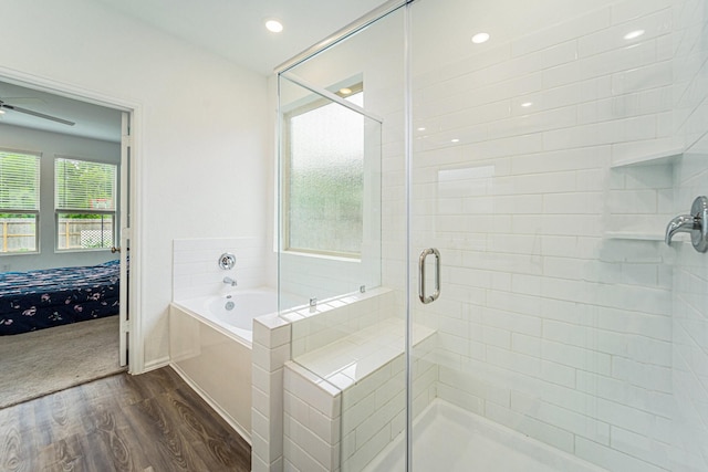 4319 Liberty Ranch Way, Baytown, TX 77521 - ensuite bathroom featuring wood finished floors, a garden tub, a stall shower, ceiling fan, and recessed lighting