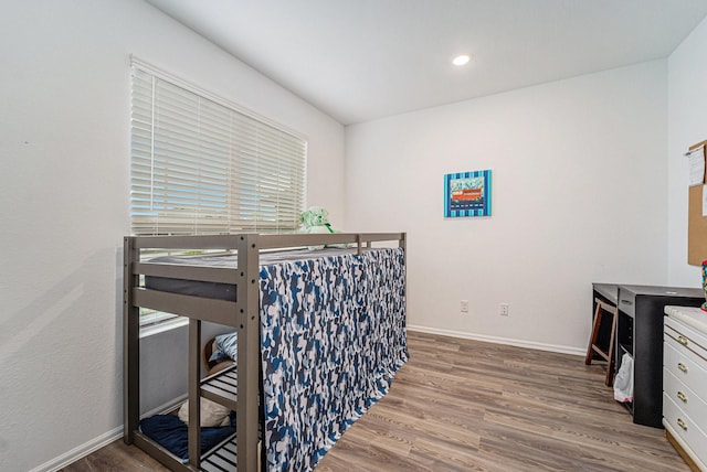 4319 Liberty Ranch Way, Baytown, TX 77521 - bedroom with wood finished floors, baseboards, and recessed lighting