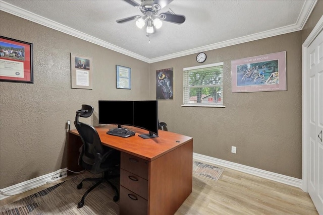 985 Sunnyside Dr, Bridge City, TX 77611 - office space featuring light wood finished floors, a textured wall, baseboards, a ceiling fan, and ornamental molding
