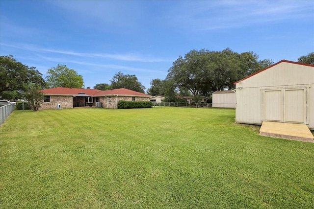 985 Sunnyside Dr, Bridge City, TX 77611 - view of yard with a storage shed and an outdoor structure