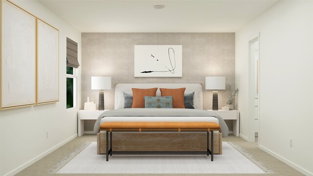 bedroom featuring light carpet, baseboards, and tile walls