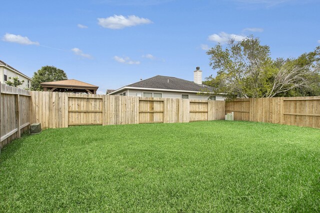 view of yard with central AC