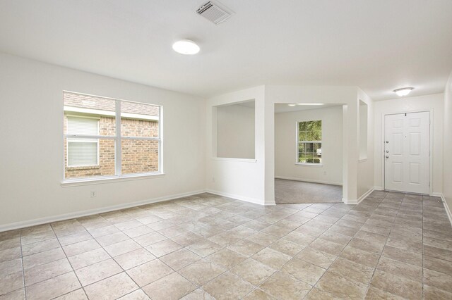 empty room featuring baseboards