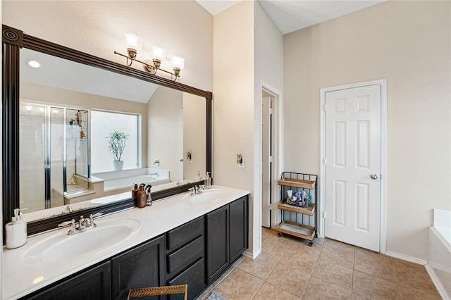 bathroom with a bath, a shower stall, tile patterned flooring, baseboards, and double vanity