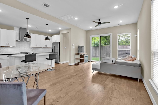 2609 Paul Quinn St, Houston, TX 77091 - living room with a ceiling fan, light wood finished floors, and recessed lighting