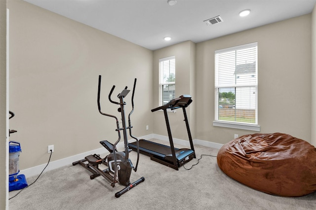 exercise room featuring carpet flooring, baseboards, and recessed lighting
