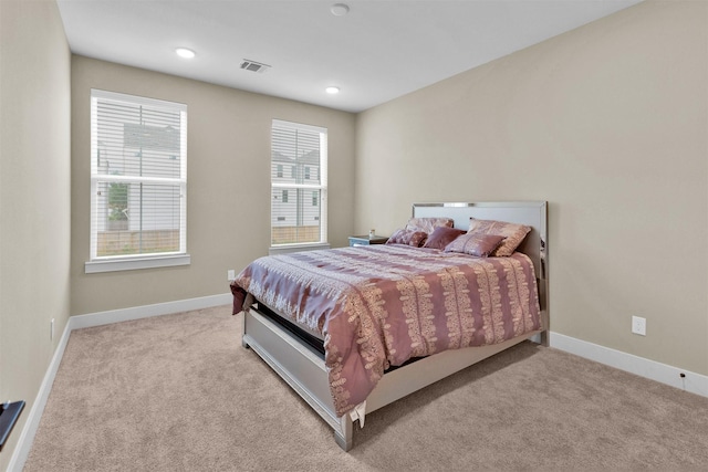 bedroom featuring carpet and baseboards
