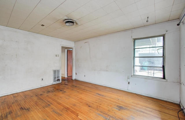 spare room featuring hardwood / wood-style floors