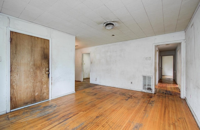empty room featuring hardwood / wood-style flooring