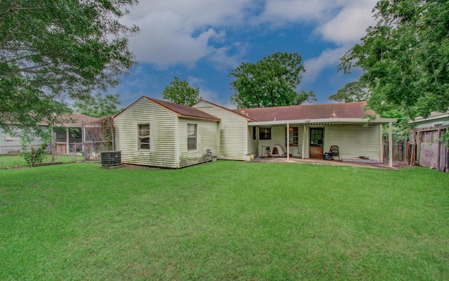 rear view of property featuring central air condition unit and a patio