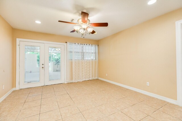 empty room with french doors, ceiling fan, recessed lighting, light tile patterned floors, and baseboards