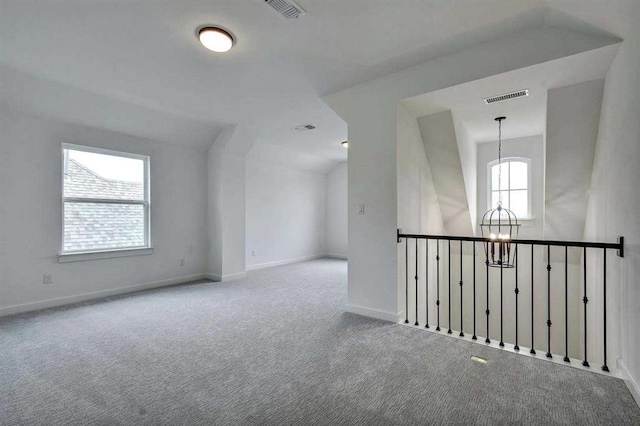 5818 Reef Ridge Dr, Manvel, TX 77578 - bonus room with a chandelier, carpet floors, baseboards, and vaulted ceiling