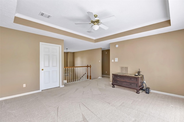 5810 Redwood River Dr, Kingwood, TX 77345 - unfurnished room with a tray ceiling, ornamental molding, carpet, and ceiling fan