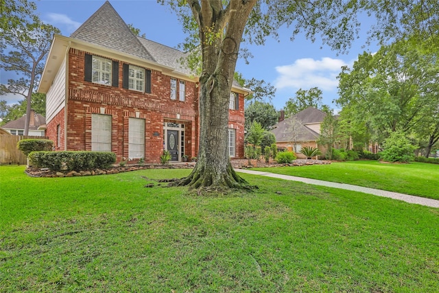 5810 Redwood River Dr, Kingwood, TX 77345 - colonial home featuring brick siding and roof with shingles