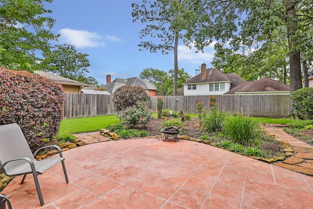 5810 Redwood River Dr, Kingwood, TX 77345 - view of patio with an outdoor fire pit and a fenced backyard