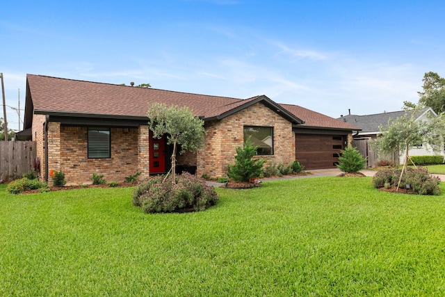ranch-style home with a garage, brick siding, and a shingled roof