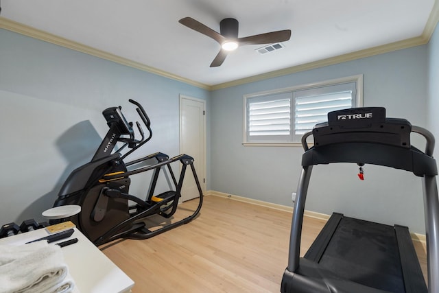 workout area featuring a ceiling fan, light wood-type flooring, crown molding, and baseboards