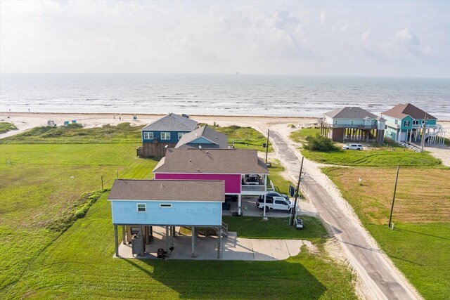 aerial view of property and surrounding area with expansive beach