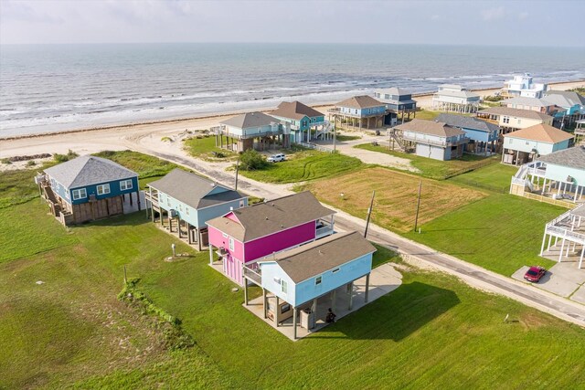 aerial view of residential area featuring extended coastline