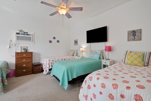 bedroom with carpet, ceiling fan, and a wall unit AC