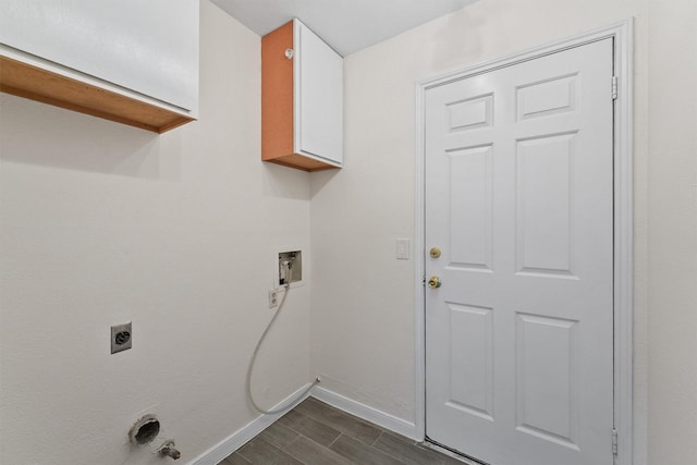clothes washing area with baseboards, hookup for an electric dryer, washer hookup, and dark wood-style flooring