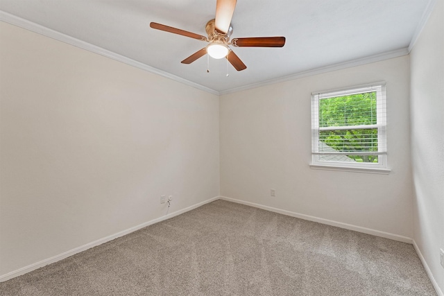 empty room with light carpet, baseboards, crown molding, and a ceiling fan